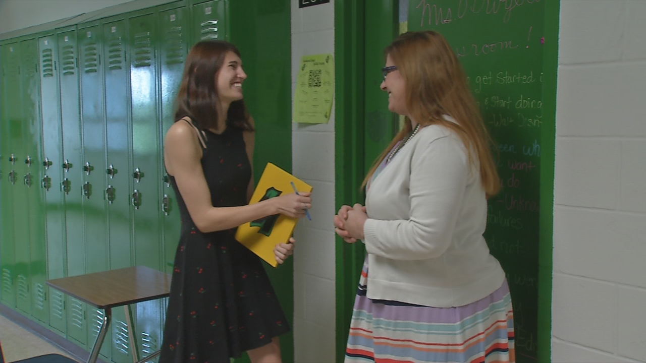 JCPS senior defies the odds with a smile, graduates with diploma and college degree